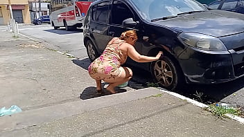 Cleaning the car on the street without panties for everyone to see